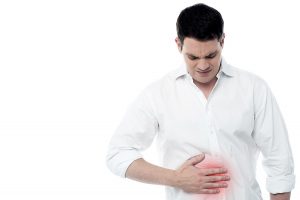 Stomach ache man placing hand on the spot.